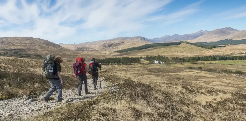 Walkers on the West Highland Way between Bridge of Orchy and Glencoe looking toward the Inveroran Hotel, © VisitScotland / Kenny Lam